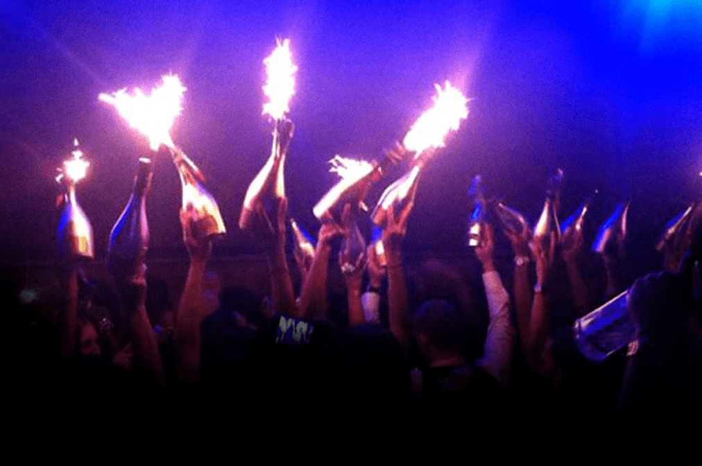 Bottles with sparklers raised over the crowd at Ultraviolet